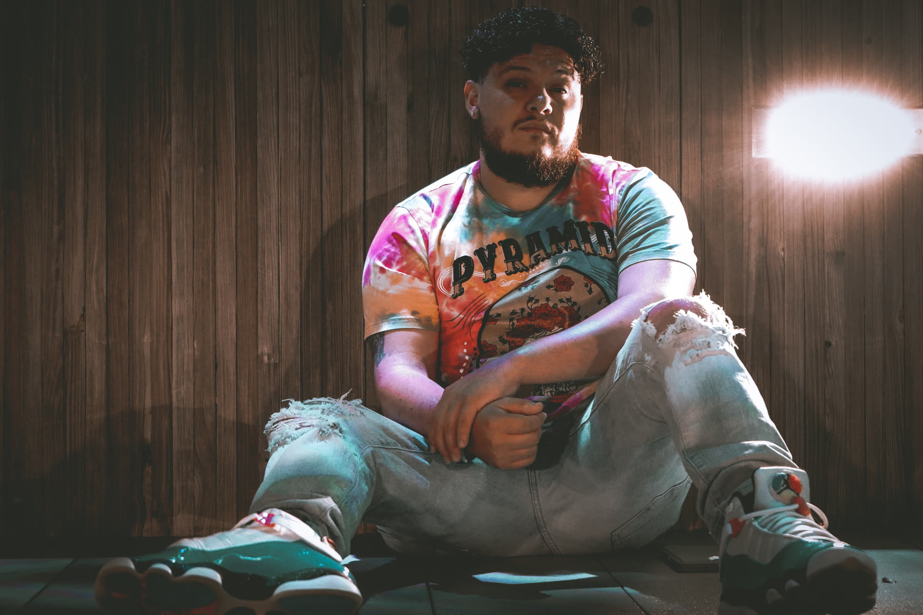 Aveek seated in the recording studio